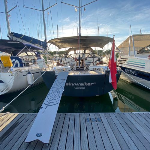 GS Composite carbon gangway connecting a sailing yacht to a marina dock